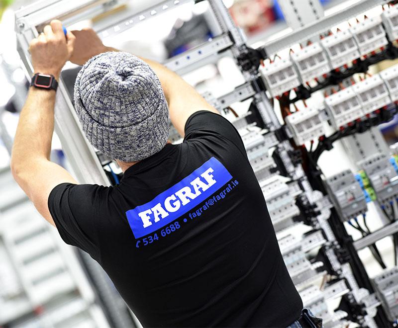 A Fagraf electrician assembling a circuit breaker cabinet